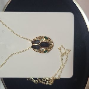 Beautiful new snake pendant with chain gold color.
